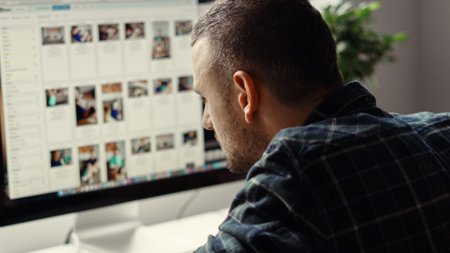 man at a computer screen